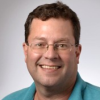 Dr. Chris E Doucet