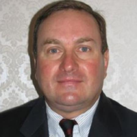 Dr. MARK EDWARD GRUBB