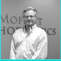 Dr. John F Moffett