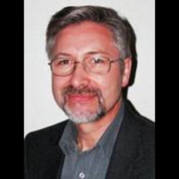 Dr. Mark  Ashiku