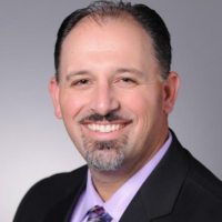 Dr. Christopher John Sakkaris