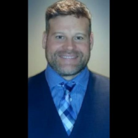 Dr. MARK E DOHERTY