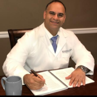 Dr. Michael  Proothi