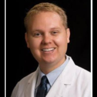 Dr. John A Benusis