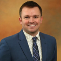 Dr. Adam R Hertig
