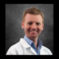 Dr. Adam E Spriggs