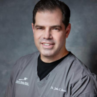 Dr. John E Russo