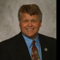Dr. Tim R Holland
