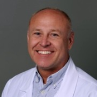 Dr. MARTIN G THOMPSON