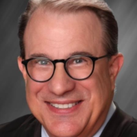 Dr. John M Lewis