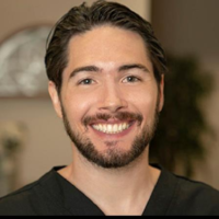 Dr. Travis M Parker