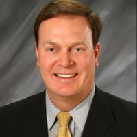 Dr. JOHN NORGE SANTIN