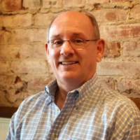 Dr. JON DOUGLAS LESAN