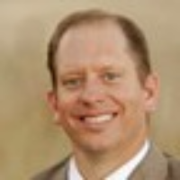 Dr. J. Brett  Mangum