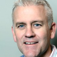 Dr. John S Everly