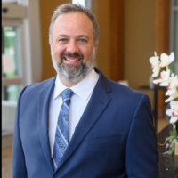 Dr. Aaron E Cruthers