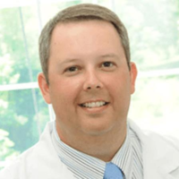 Dr. Aaron M Moore
