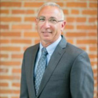 Dr. Mark H Melnick